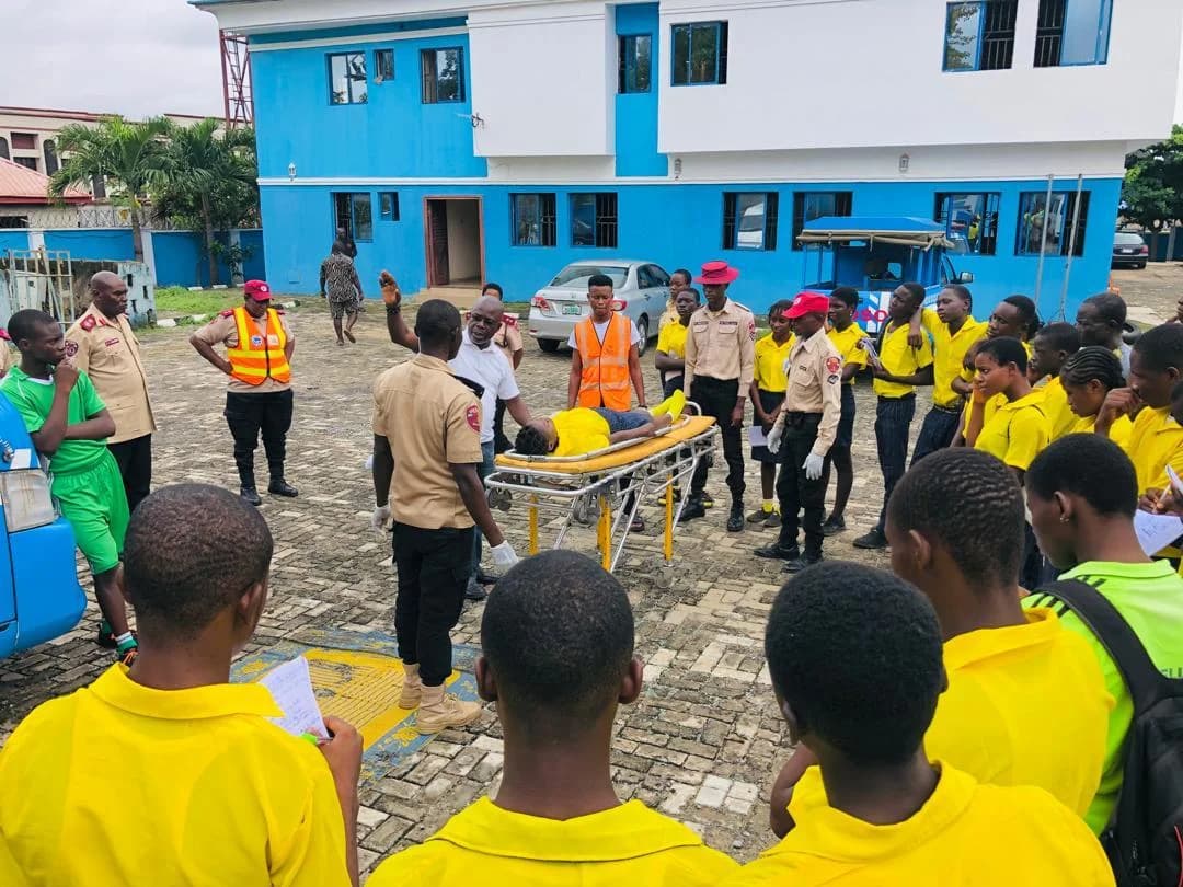 Goodnews pupils observing a practical road safety demonstration